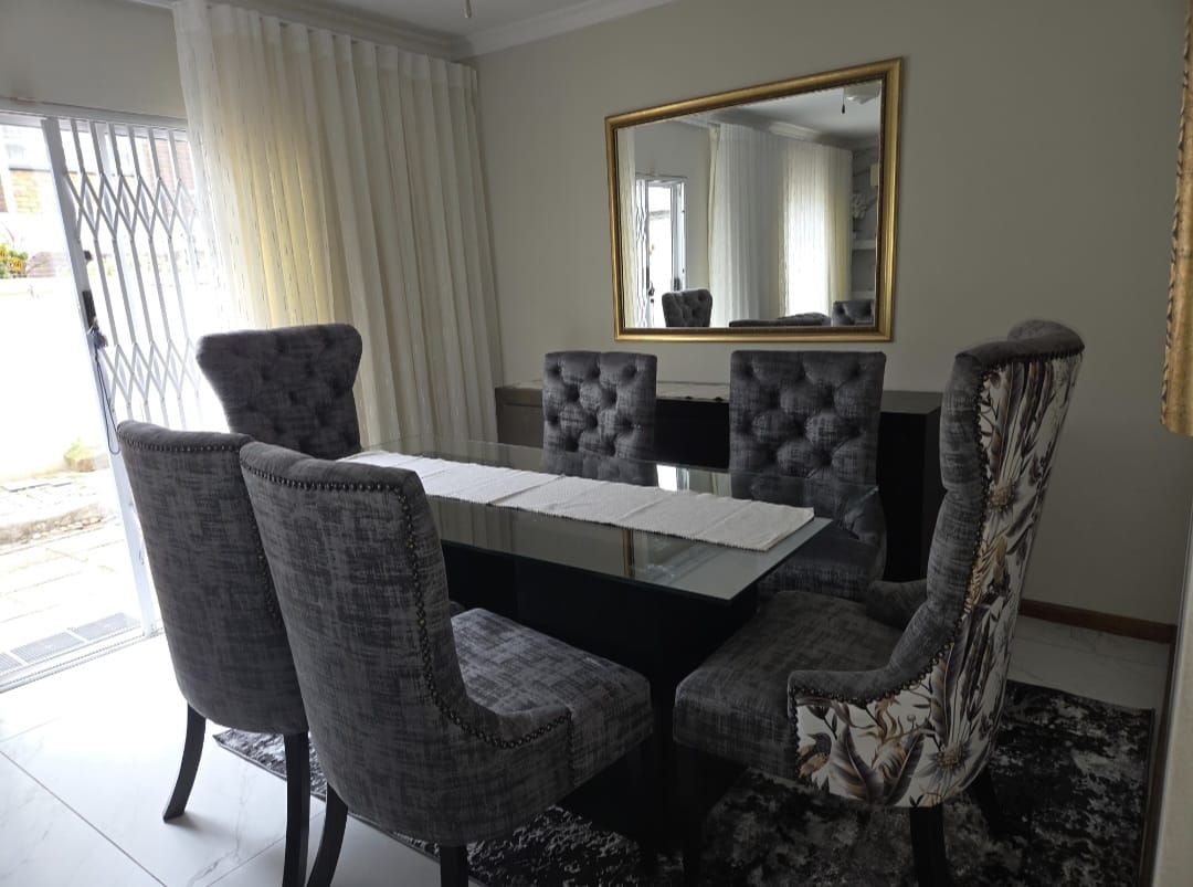 Tufted dining chairs with floral accent